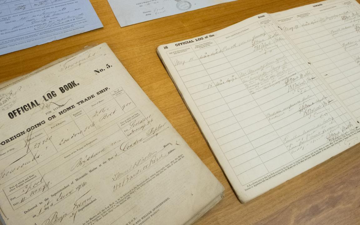 Old documents including an two official log books of shipping activity