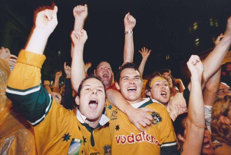 Three friends watch Rugby World Cup 2003 from the Rocks