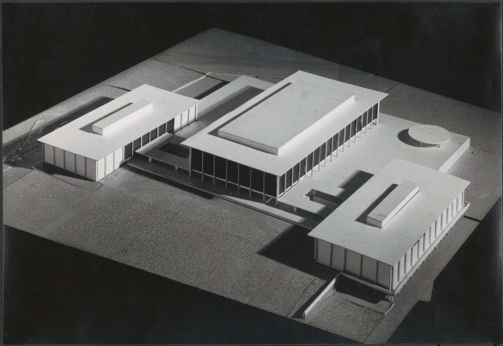 Simple model of three rectangular, connected buildings with columns and flat rooves.