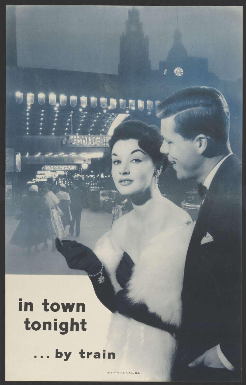 Man and woman in fancy dress in front of a train station at night, with text reading 'in town tonight ... by train'