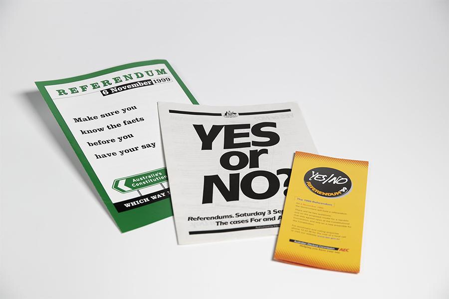 Three pamphlets on a white background. The middle one has text reading 'Yes or No'