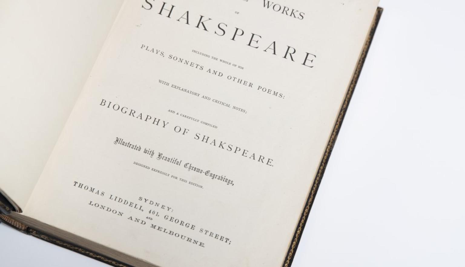 Old book open to title page reading 'The complete works of Shakespeare'