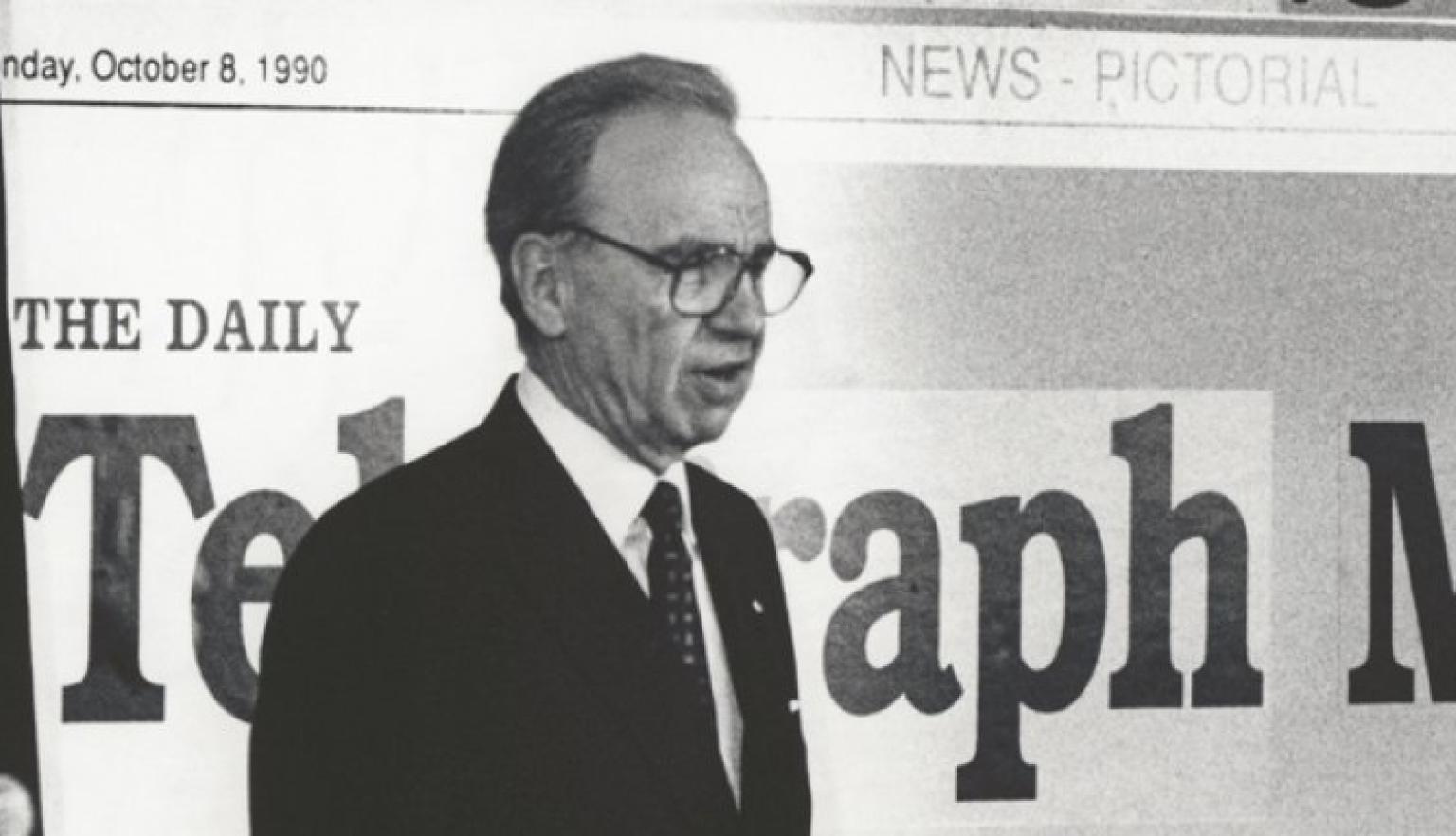 Rupert Murdoch announces newspapers mergers during a media conference