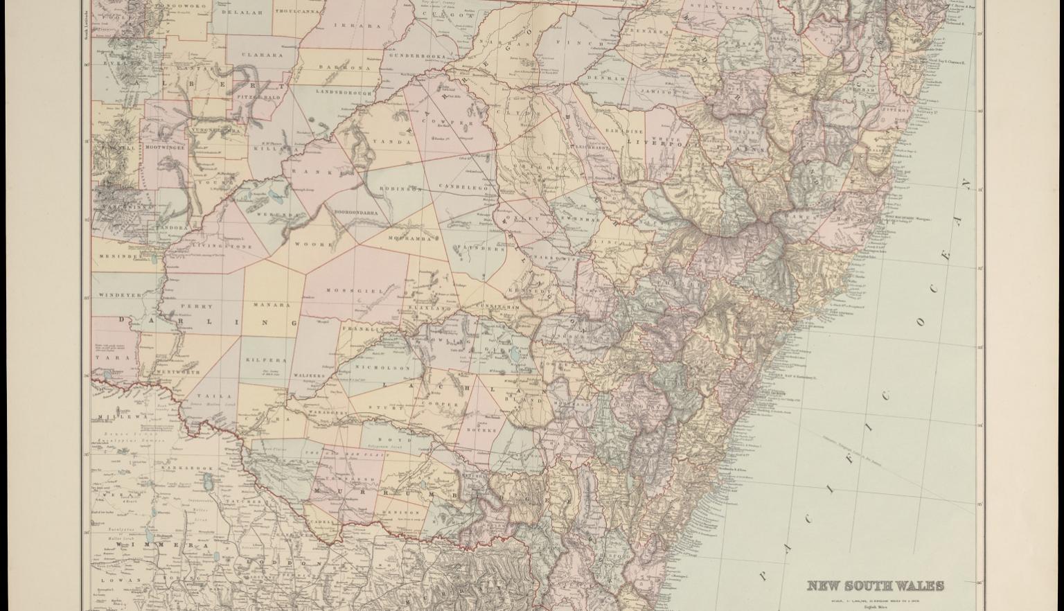 A detailed map of New South Wales, Australia, highlighting the state's geographic features, towns, districts, and boundaries as they were in the late 19th or early 20th century. The map is color-coded to differentiate between counties and regions, with major towns and cities marked. The eastern coastal areas, adjacent to the Pacific Ocean, display more densely populated regions, while the western areas show large, sparsely populated districts.