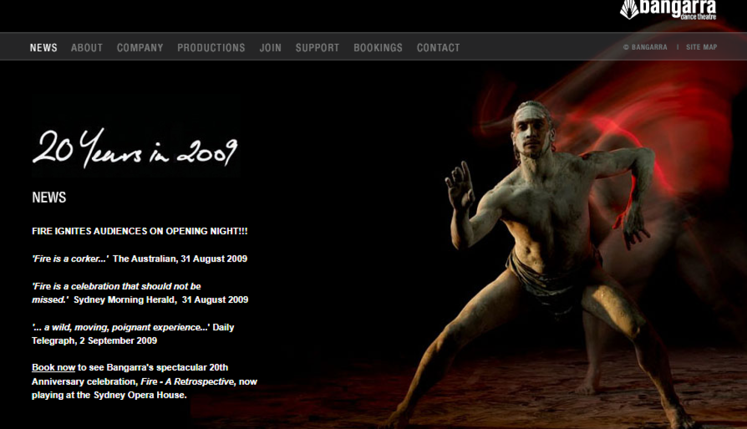 Dark website 'News' page with test reading '20 Years in 2009' and 'Fire Ignites Audiences on Opening Night!!!' along with a stylised photo of a First Nations man dancing